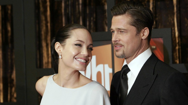 Angelina Jolie and Brad Pitt attending an event