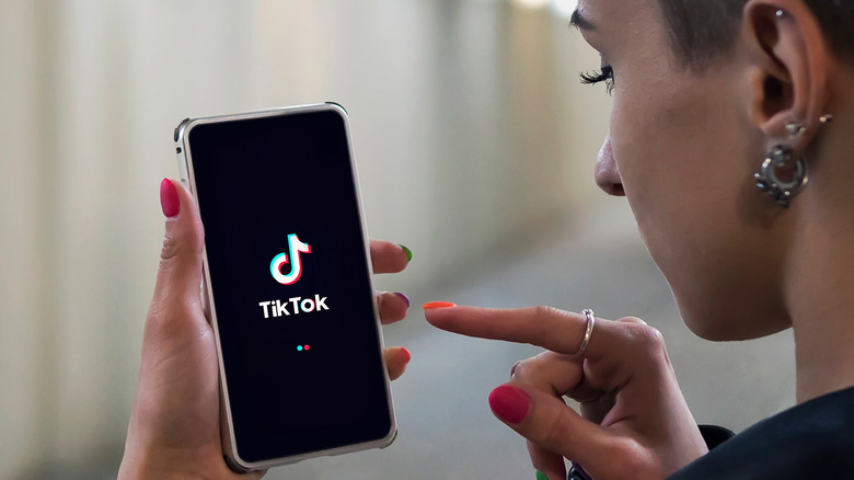 Person scrolling on TikTok 