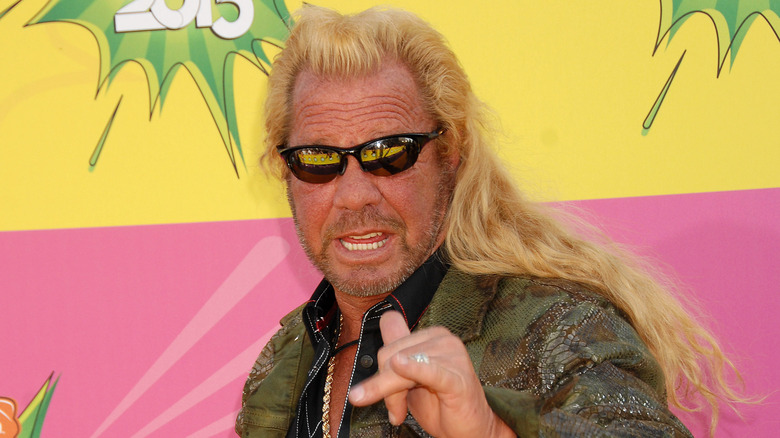 Dog the Bounty Hunter poses on the red carpet