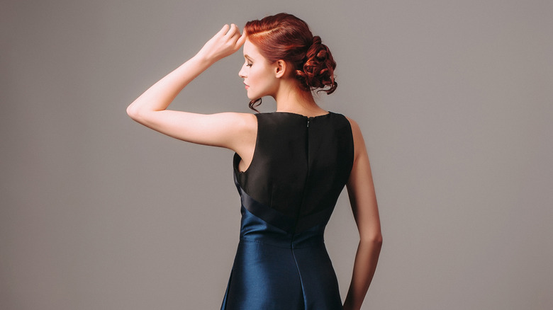 Woman wearing navy blue dress