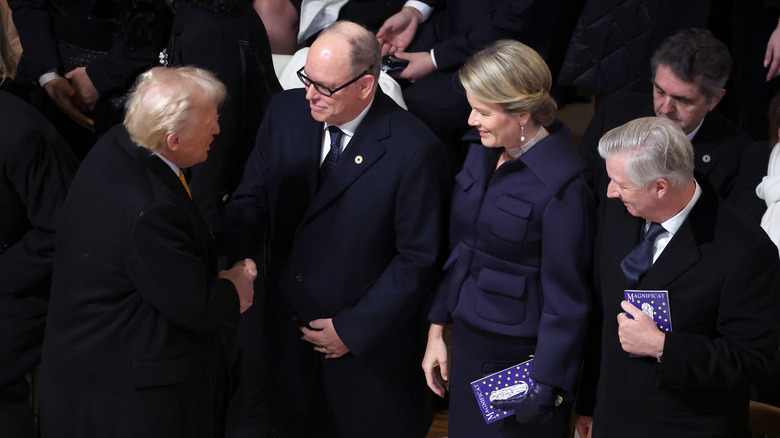 Prince Albert and Donald Trump shake hands at Notre Dame