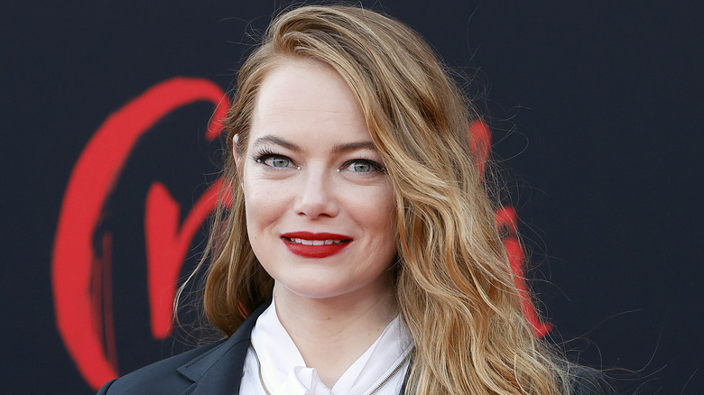 Emma Stone wearing red lipstick on the red carpet