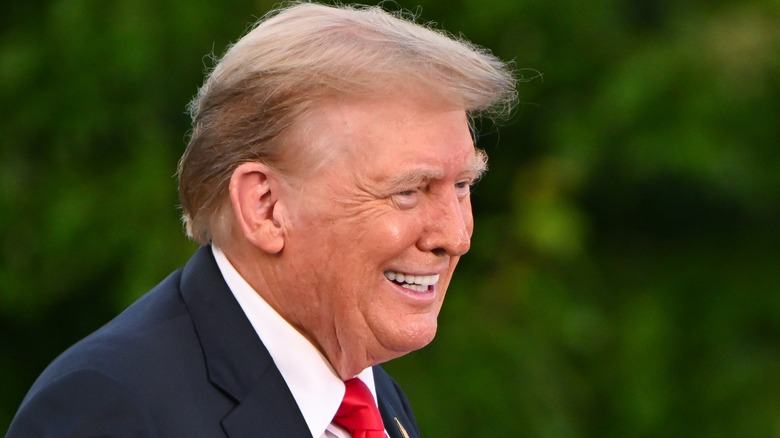 Donald Trump smiling and showing his teeth