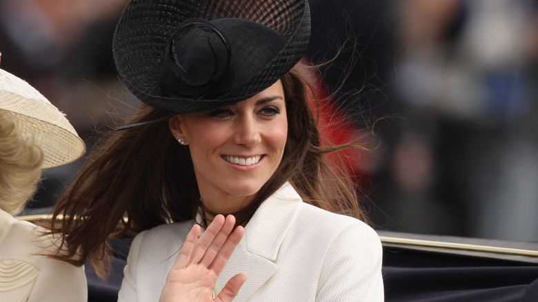 Kate Middleton smiling and waving