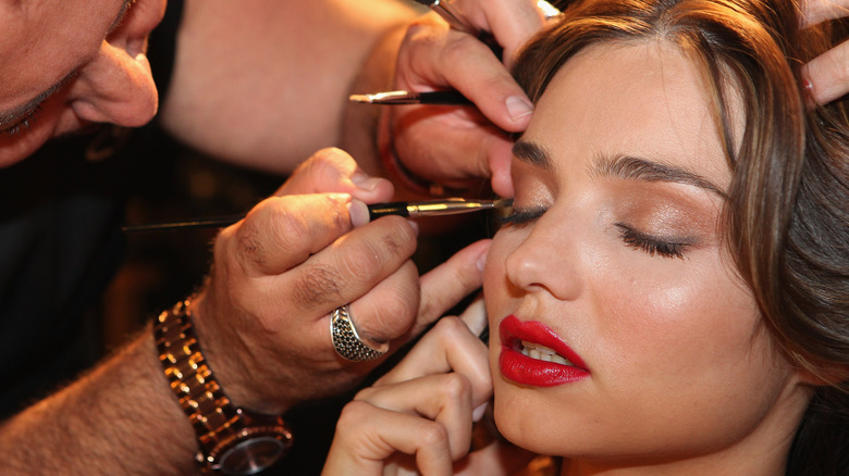 makeup artist applying makeup 