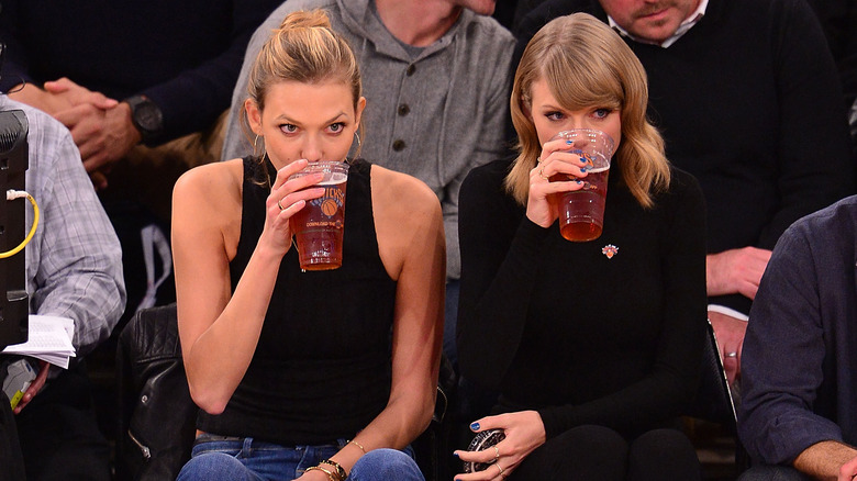 Taylor Swift and Karlie Kloss at a basketball game