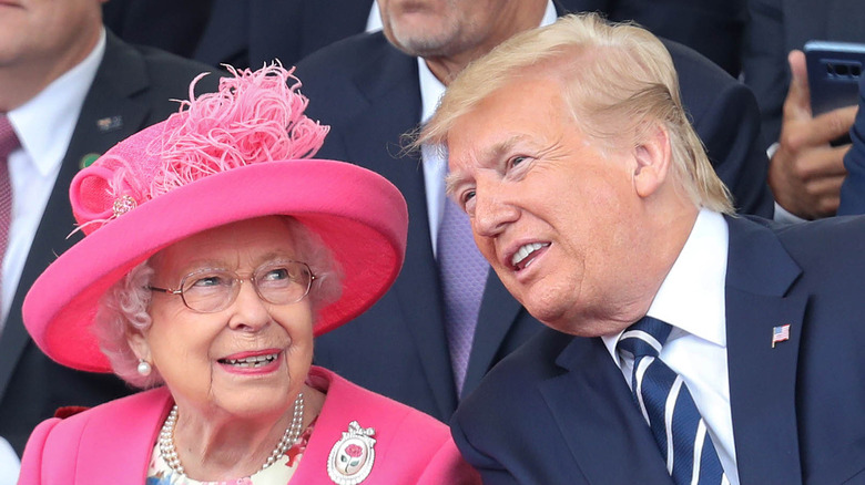 Donald Trump talking to a smiling Queen Elizabeth