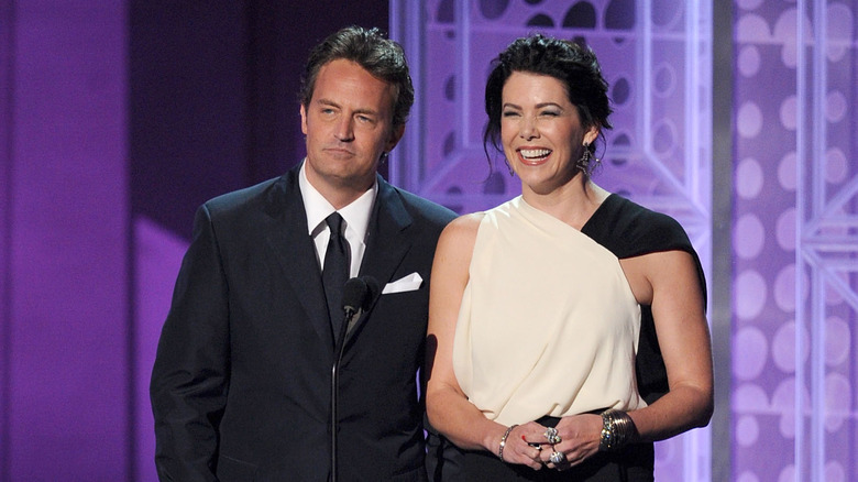 Lauren Graham and Matthew Perry together on stage announcing an Emmy