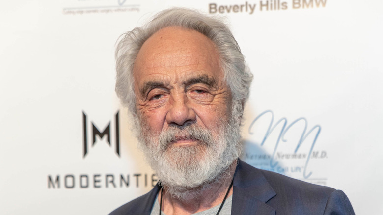 Tommy Chong in suit jacket against white background