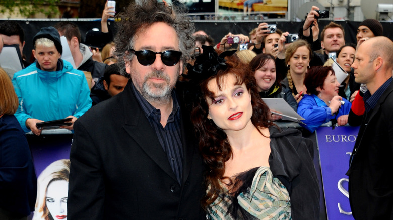 Helena Bonham Carter and Tim Burton posing at a film premiere in 2012