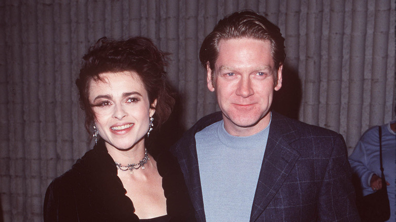 Smiling Helena Bonham Carter and Kenneth Branagh posing for photographers in 1998