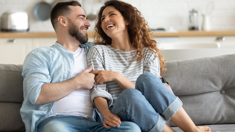 Happy couple laughing together