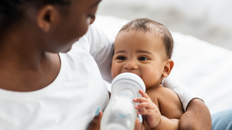 baby drinking from bottle