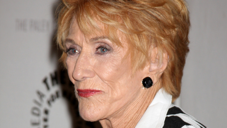 Jeanne Cooper posing black earrings