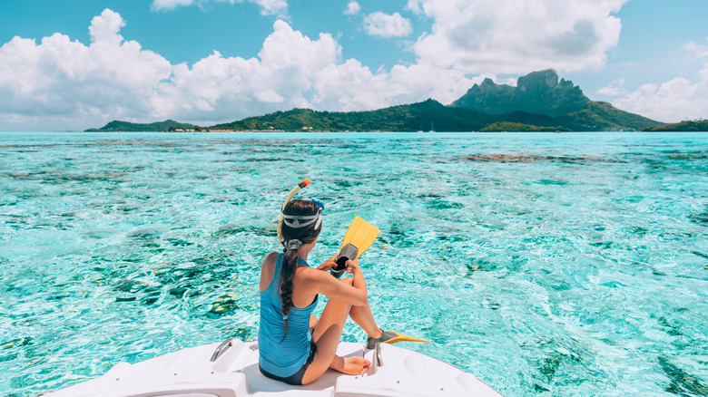 Girl prepping to snorkel on Bora Bora