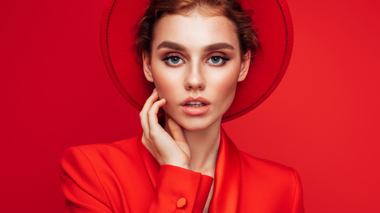 Woman wearing red jacket and red hat