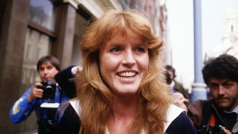 Sarah Ferguson smiling around photographers