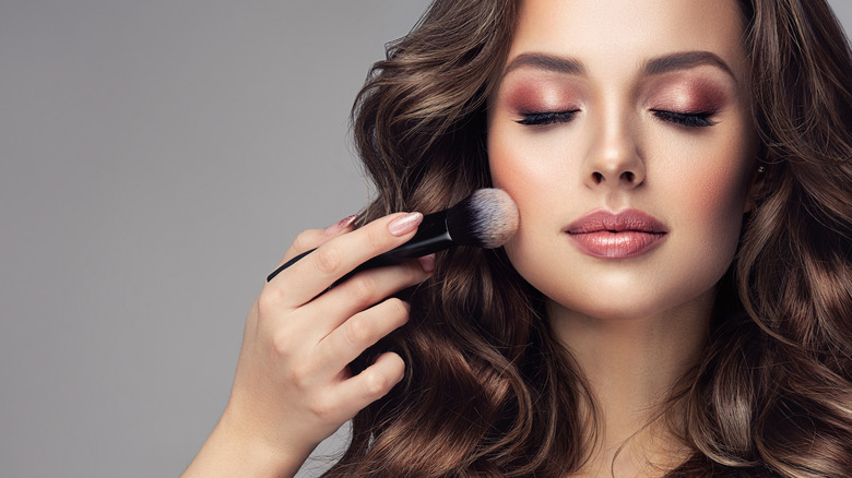 Makeup being applied with a brush 