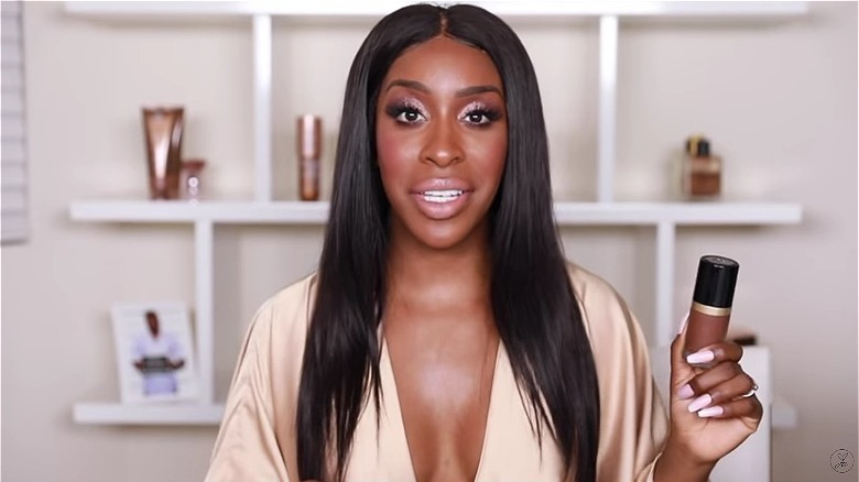 Jackie Aina with Too Faced's Born This Way foundation