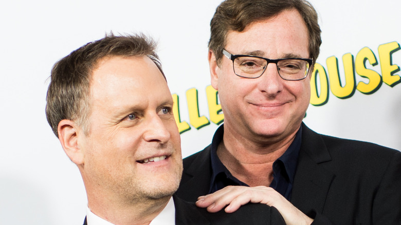 Bob Saget with hand on Dave Coulier's shoulder