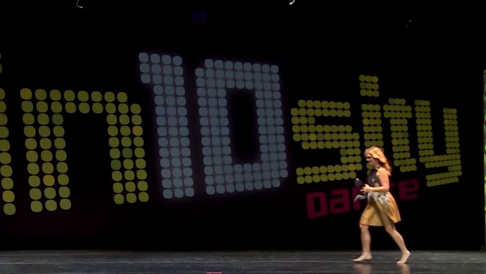 Melissa Gibsoni from Dance Moms running on stage