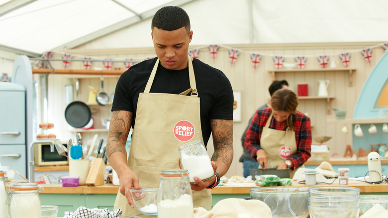 contestants baking on an episode of the great british bake off