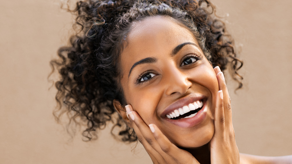 Women smiling with curly hair