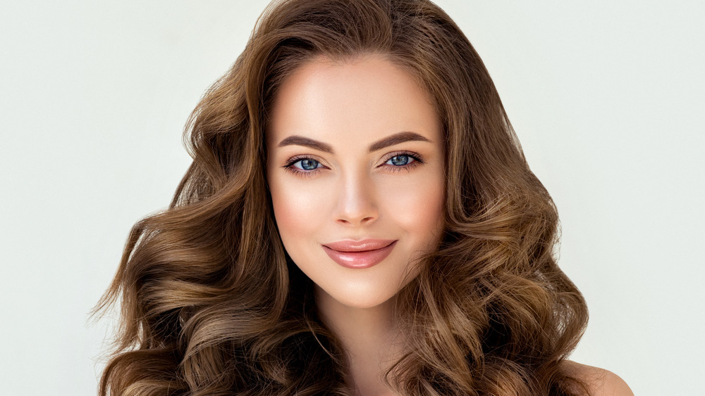 Woman with curly brown hair