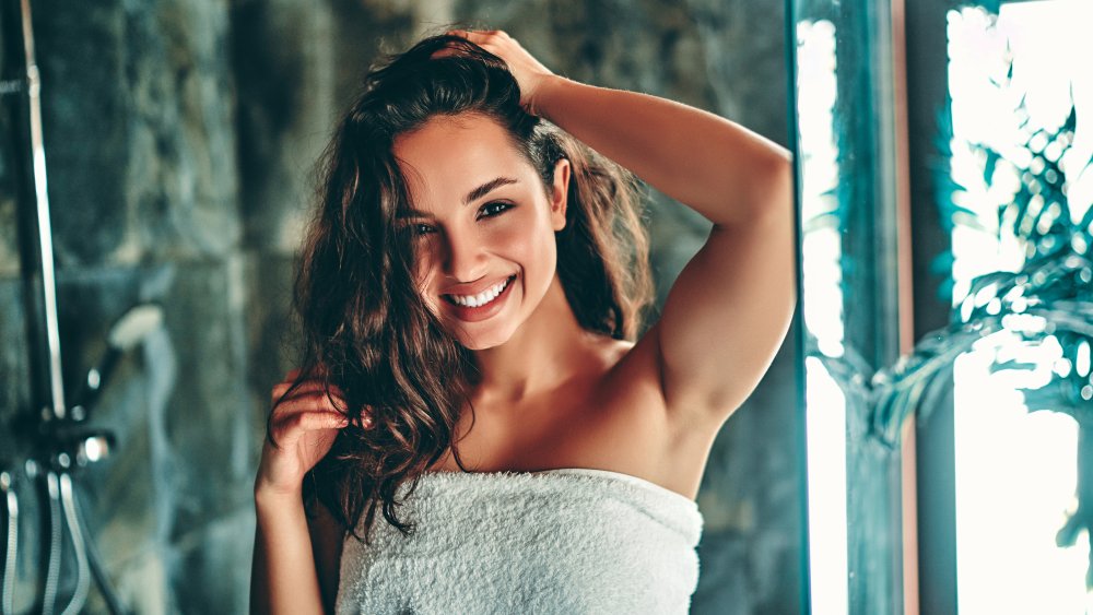 Woman towel drying