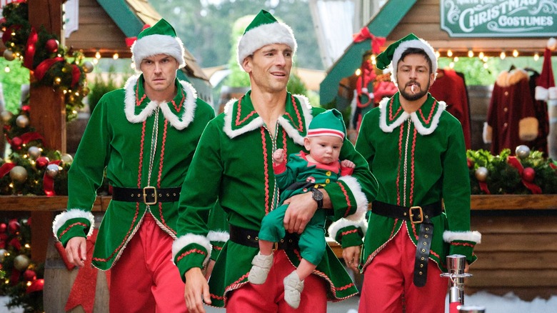 Paul Campbell, Andrew Walker, and Tyler Hynes with a baby in "Three Men with a Baby"