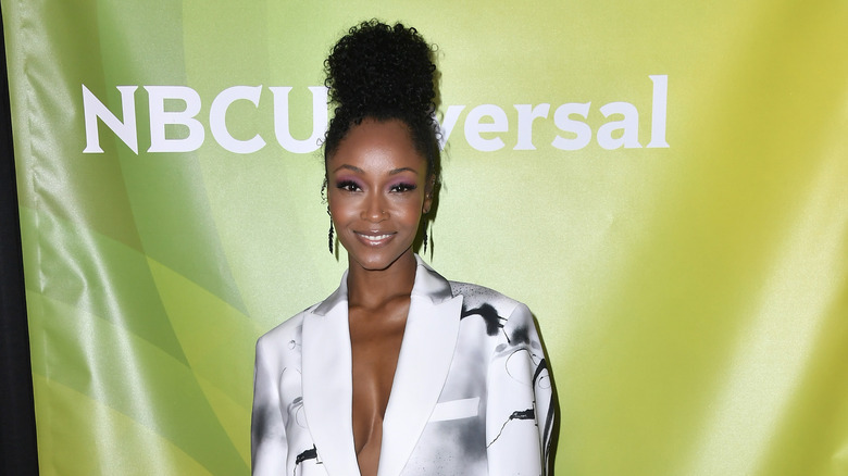 Yaya DaCosta smiles at an event