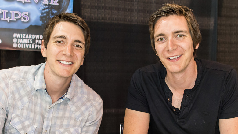 Harry Potter stars James and Oliver Phelps at an event