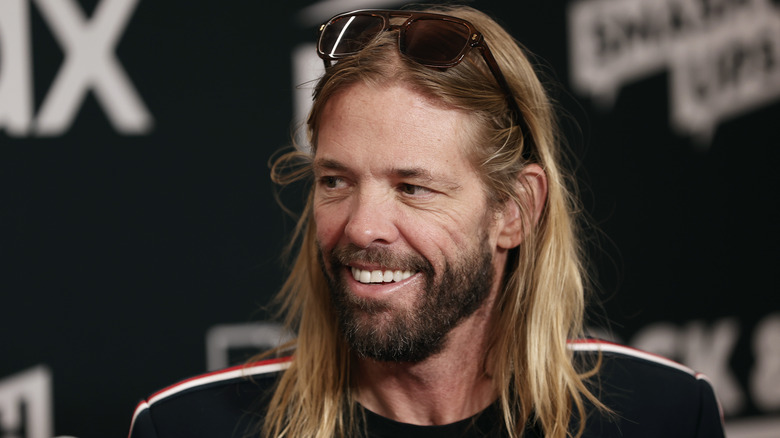 Taylor Hawkins smiling and looking to his right