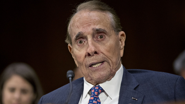 Bob Dole speaking into a microphone.