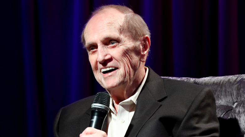 Bob Newhart smiling with microphone