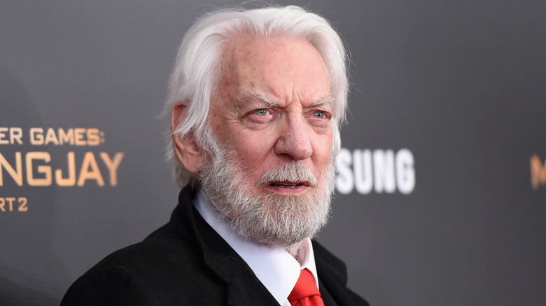 Donald Sutherland posing at Hunger Games premiere 2015