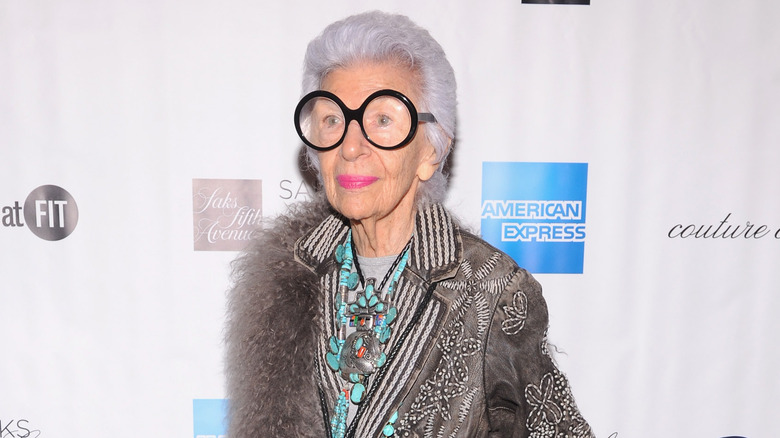 Iris Apfel wearing gray and turquoise