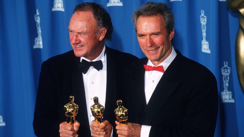 Gene Hackman and Clint Eastwood holding Oscars