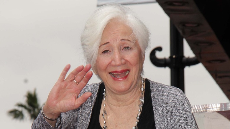 Olympia Dukakis waving at event