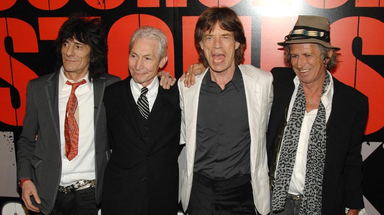 The Rolling Stones smiling together 