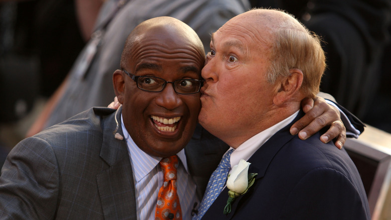 Willard Scott kissing Al Roker's face