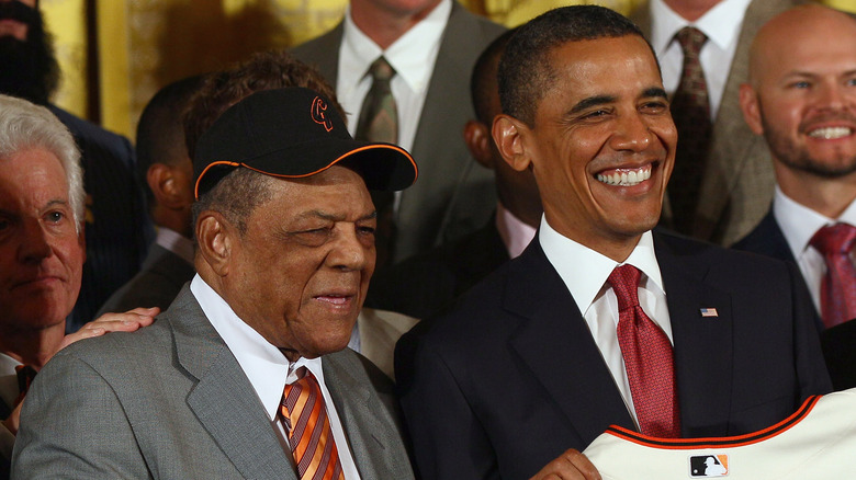 President Barack Obama and Willie Mays smiling