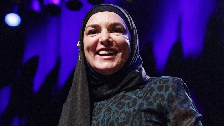 Sinead O'Connor smiling on stage 