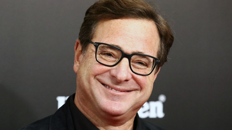 Bob Saget smiling at event