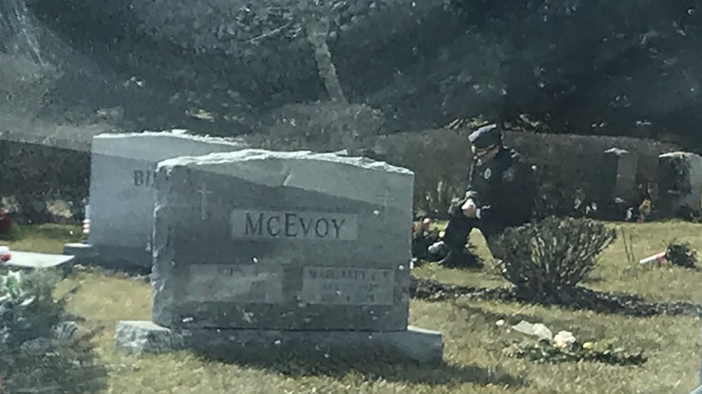 Mourner at Beau Biden's grave