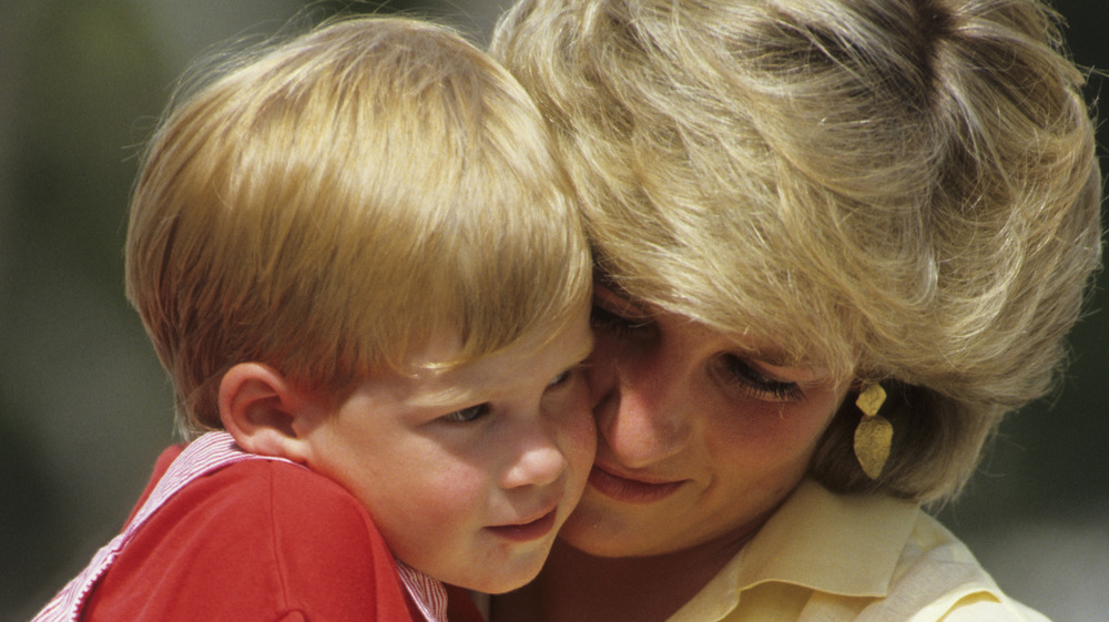 Princess Diana holding Prince Harry