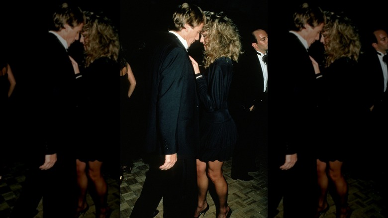 Ryan O'Neal and Farrah Fawcett in an intimate moment