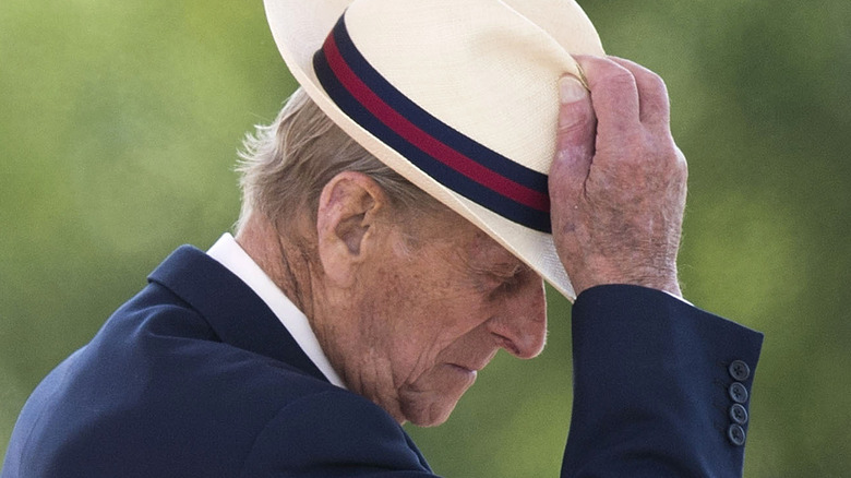 Prince Philip tips his hat