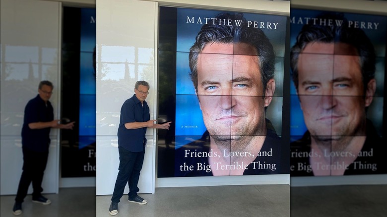 Matthew Perry posing with his giant book cover