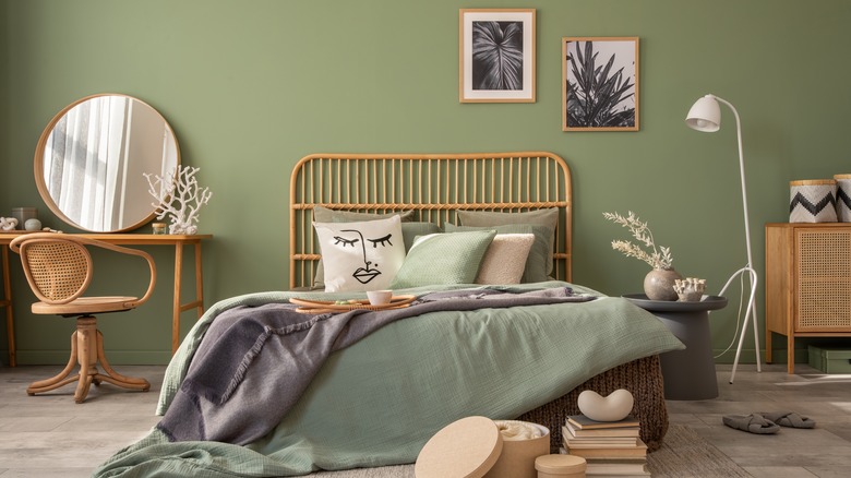 green bedroom with tan furniture